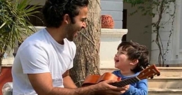 মামার পাশে বসে ইউকেলেলে বাজাতে ব্যস্ত ছোট্ট তৈমুর