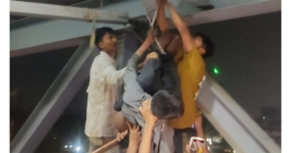 উত্তরায় ছিনতাইকারীকে ধরে ব্রিজে ঝুলাল উত্তেজিত জনতা